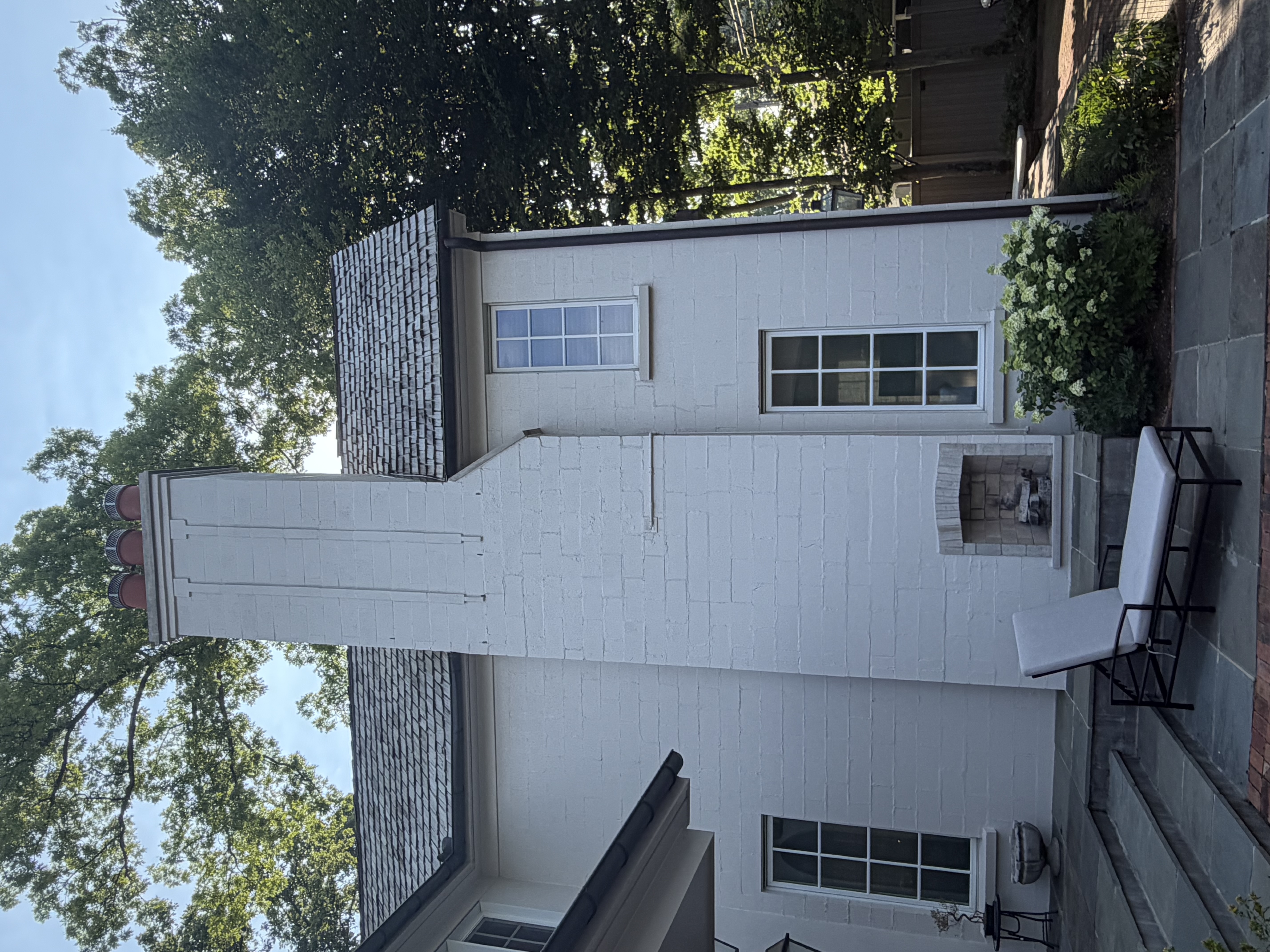 Completed chimney, luxury home with outdoor seating